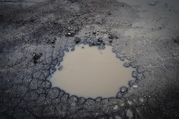 large pot hole in the road