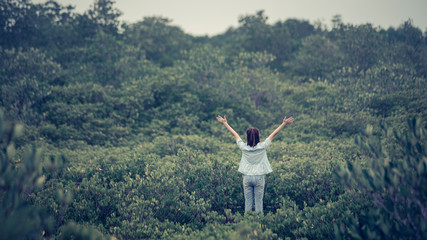 Fototapeta premium Happy women enjoying nature. Outstretched arms in summer or spring. copy space.