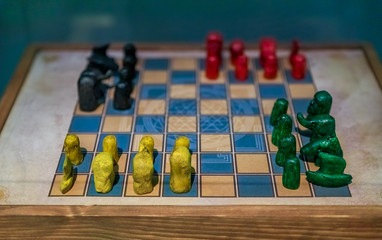 Antique chaturanga game board with pieces © SvetlanaSF