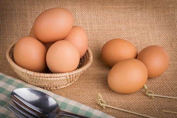 Set Eggs in a basket on  gunny (sackcloth)  background