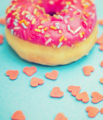 pink donuts with sprinkles and sugar hearts