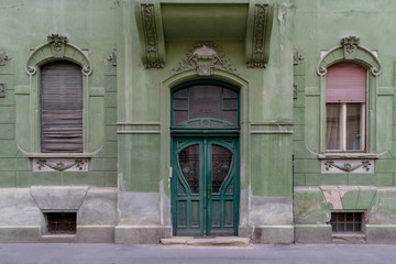 A green door of a green house in Sibiu, Romania