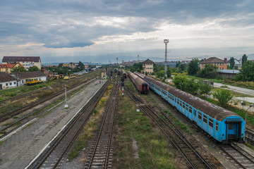 Fototapeta premium The abandoned train wagons in a railway station