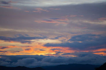 Sky and cloud at sunset with dark and vibrant light at  dusk