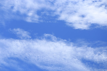 Blue bright clear sky and white cloud. Scene of sunny nature. Cloudscape