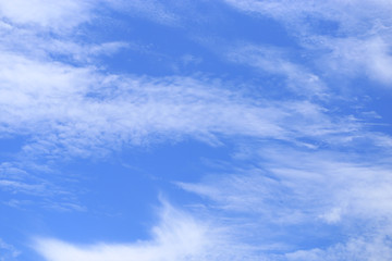 Naklejka na ściany i meble Blue bright clear sky and white cloud. Scene of sunny nature. Cloudscape