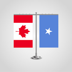 Table stand with flags of Canada and Somalia.Two flag. Flag pole. Symbolizing the cooperation between the two countries. Table flags