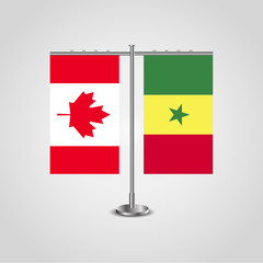 Table stand with flags of Canada and Senegal.Two flag. Flag pole. Symbolizing the cooperation between the two countries. Table flags