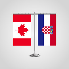 Table stand with flags of Canada and Croatia.Two flag. Flag pole. Symbolizing the cooperation between the two countries. Table flags