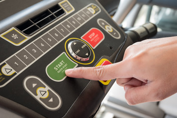 Close up of hand putting control start machine exercise