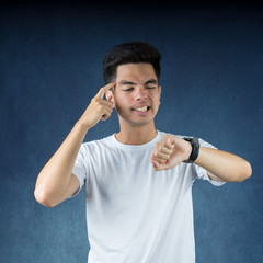 Portrait Handsome young asian man wearing a white shirt serious and looking at his watch business isolated on white background. Businessman concept. Asia people.