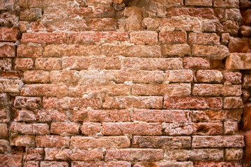 Dark red old bricks wall.