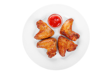 Wings of chicken grilled four, baked, fried over an open fire, with red, ketchup, barbecue sauce. Appetizing, juicy, crunchy, on white isolated background View from above For the menu, restaurant, bar
