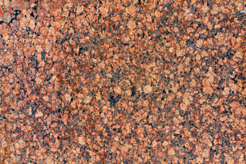 Red granite slab closeup. Natural stone texture