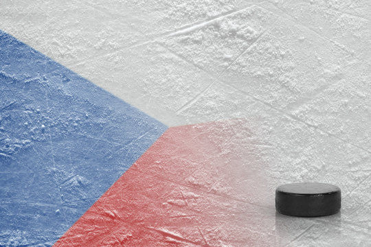 Hockey puck and the image of the Czech flag on the ice