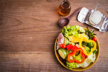 Fresh healthy salad on wood background. Weight loss. Slimming