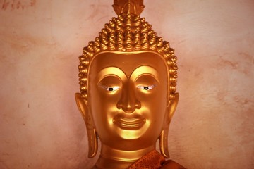 Buddha image god within gold colored in the ayutthaya historical park Thailand