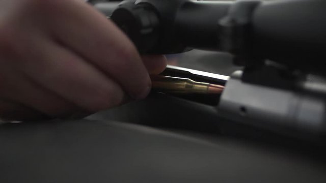 putting a bullet in a rifle