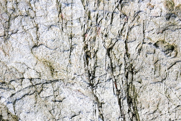 Rock texture and surface background. Cracked and weathered natural stone background.