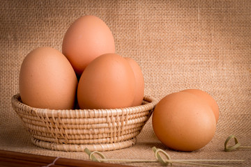 Set Eggs in a basket on  gunny (sackcloth)  background