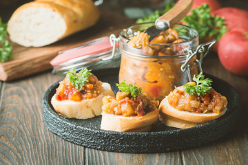 Bread toasts with eggplant caviar.