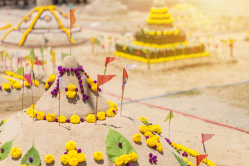 Fototapeta premium Thai people come to build the Sand Pagoda for return the sand to the temple on Songran festival at Ratchaburana temple in Phitsanulok Thailand.