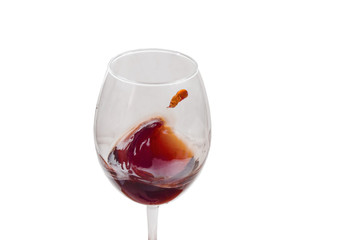 in a large glass a splash of red young wine