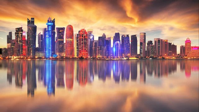 Skyline of modern city of Doha in Qatar, Middle East - Time lapse at sunset