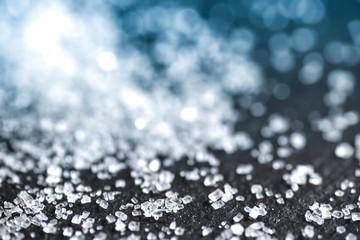 sugar on black background macro close up