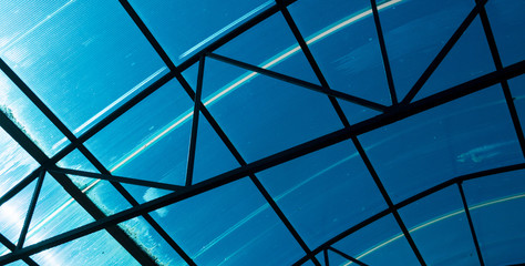 Blue glass roof. Glass architecture. Abstract blue background. Indoor pavilion. Modern architecture
