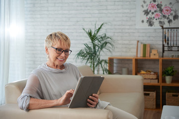 Senior woman with digital tablet