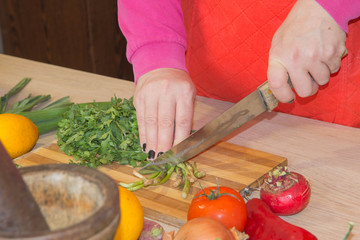 hands cooking in kitchen at home healthy food. Chef Woman cooking in the kitchen