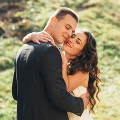 Walk just married on the background of the old castle