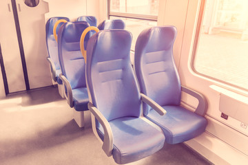 Naklejka na ściany i meble Salon of the speed commuter train with empty blue seats