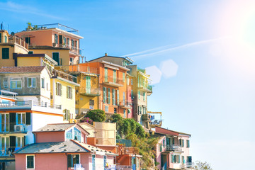 Colorful traditional houses on a rock over Mediterranean sea, Manarola, Cinque Terre, Italy