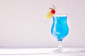 Blue Curacao cocktail decorated with fruit.