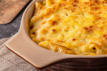 Mac and cheese, american style macaroni pasta in cheesy sauce.