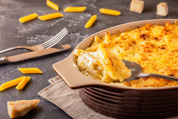 Mac and cheese, american style macaroni pasta in cheesy sauce.