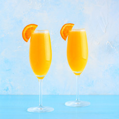 Yellow cocktail on a bright background.