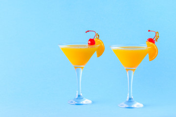 Yellow cocktail on a bright background.