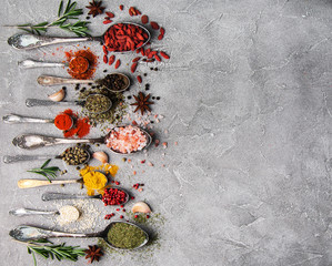 Different kind of spices in vintage spoons