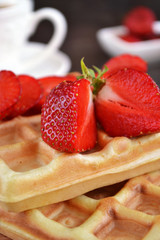 Belgian waffles with fresh strawberry. Closeup. Selective focus.