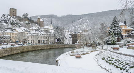 Snow covered Esch sur Sure town with lovely background of snow capped hills
