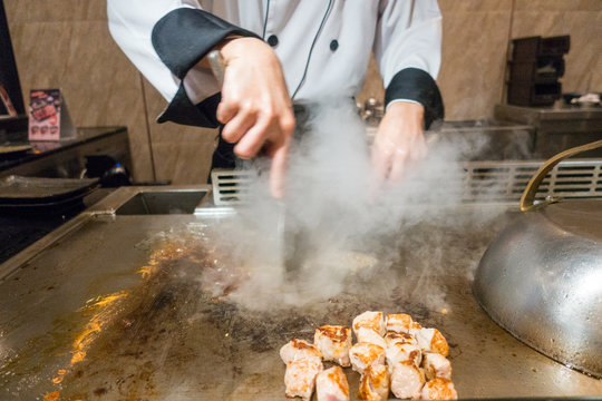 Japanese chef cooking pork steak