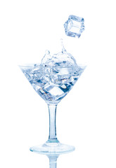 Splash from ice cube in a   wine glass of water