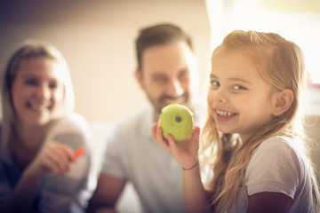 Fototapeta premium Holding green apple in hand.