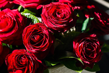 Bed maid-up with clean white pillows and bed sheets in beauty room. Close-up. Lens flair in sunlight.
