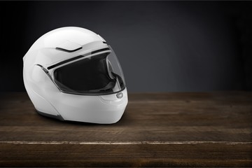 Biker helmet on wooden table