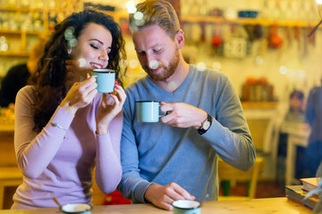Romantic couple having date in coffee shop