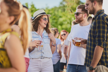 Group of people dancing and having a good time at the outdoor party/music festival